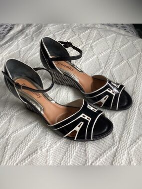 Piccadilly patent leather wedge heels made in Brasil. Size US 7